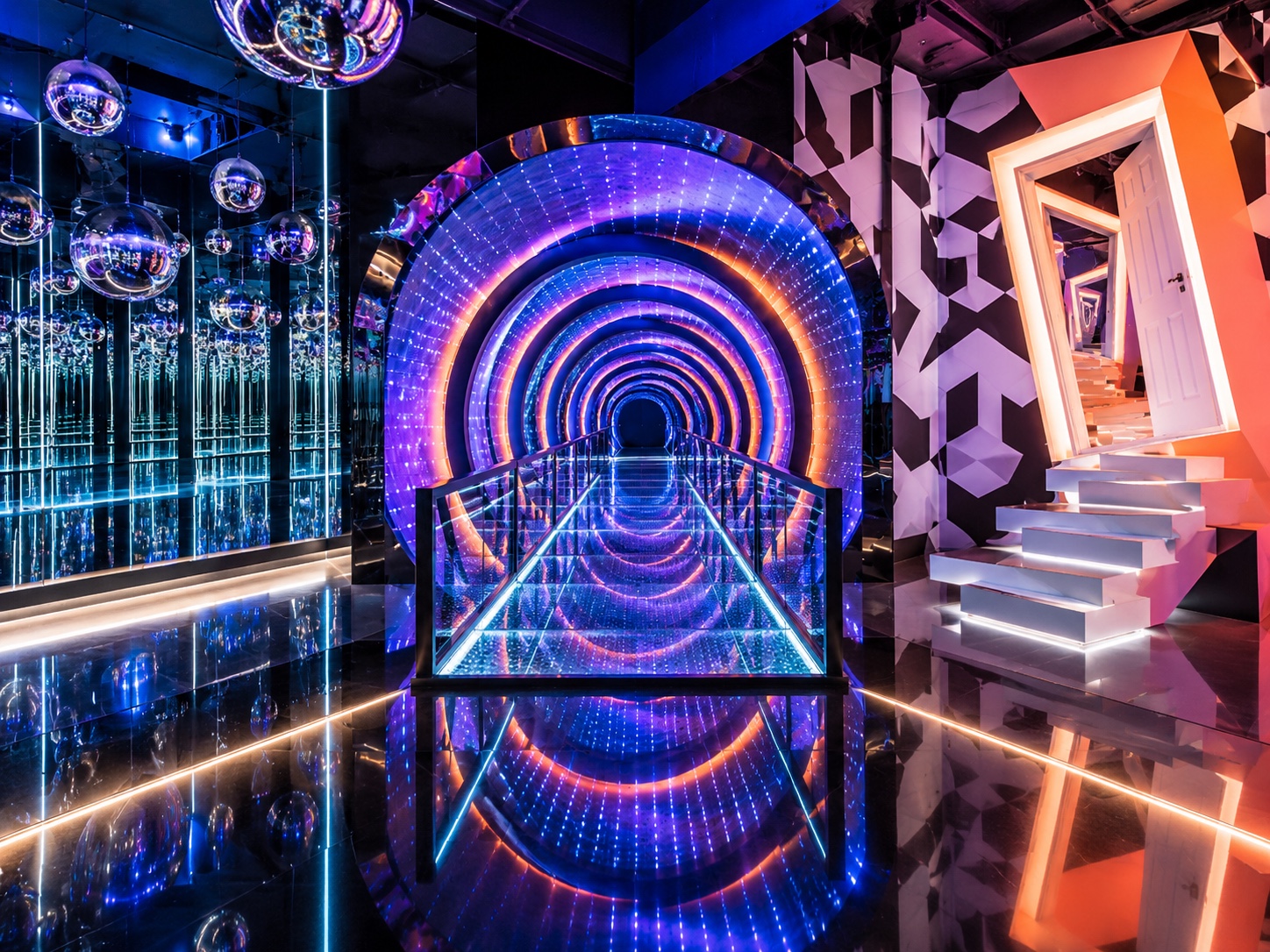 An illuminated illusion tunnel, mirrored room and angled doorway