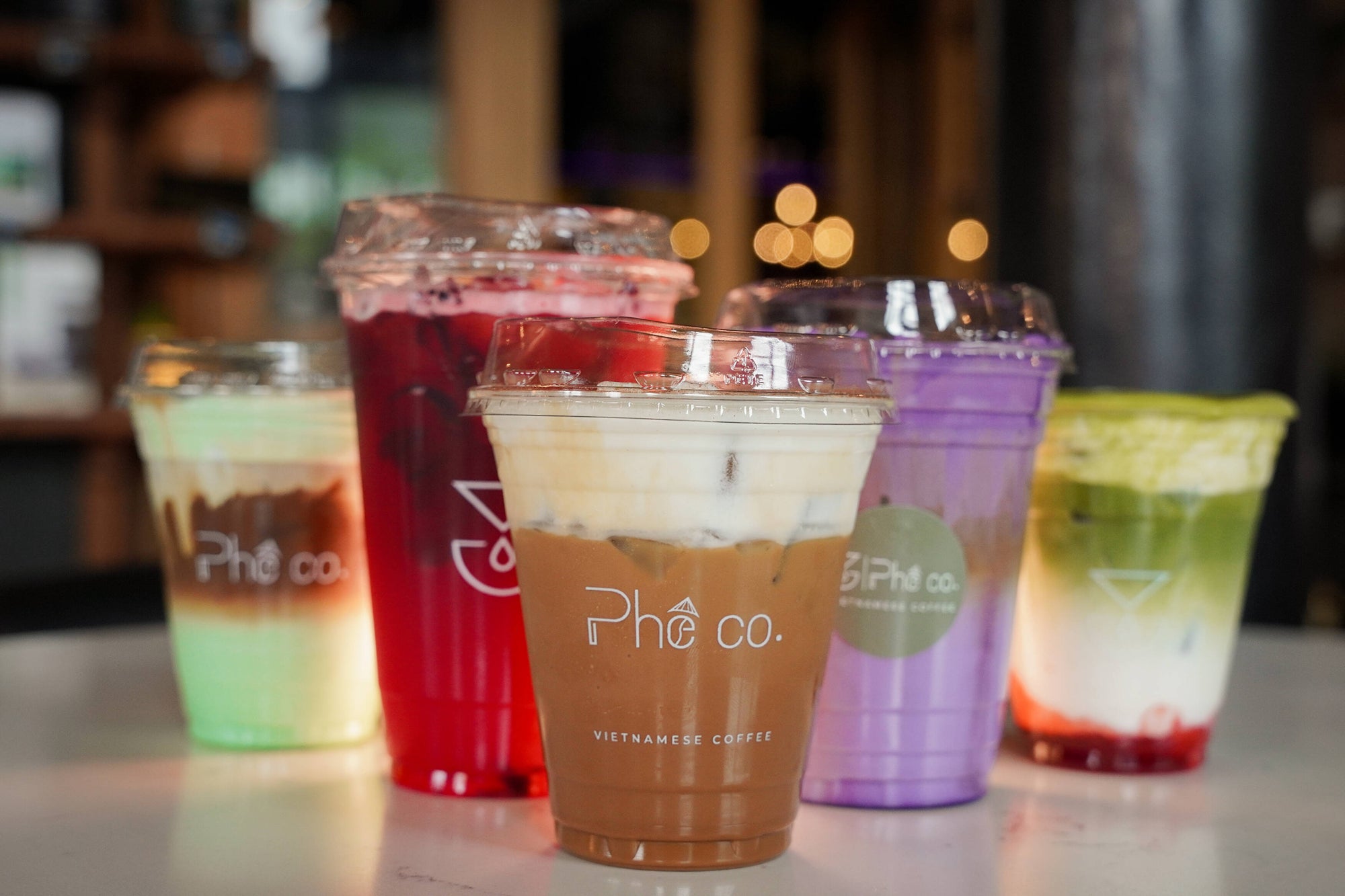 Colorful lineup of branded Vietnamese coffee drinks at Phê Coffee House