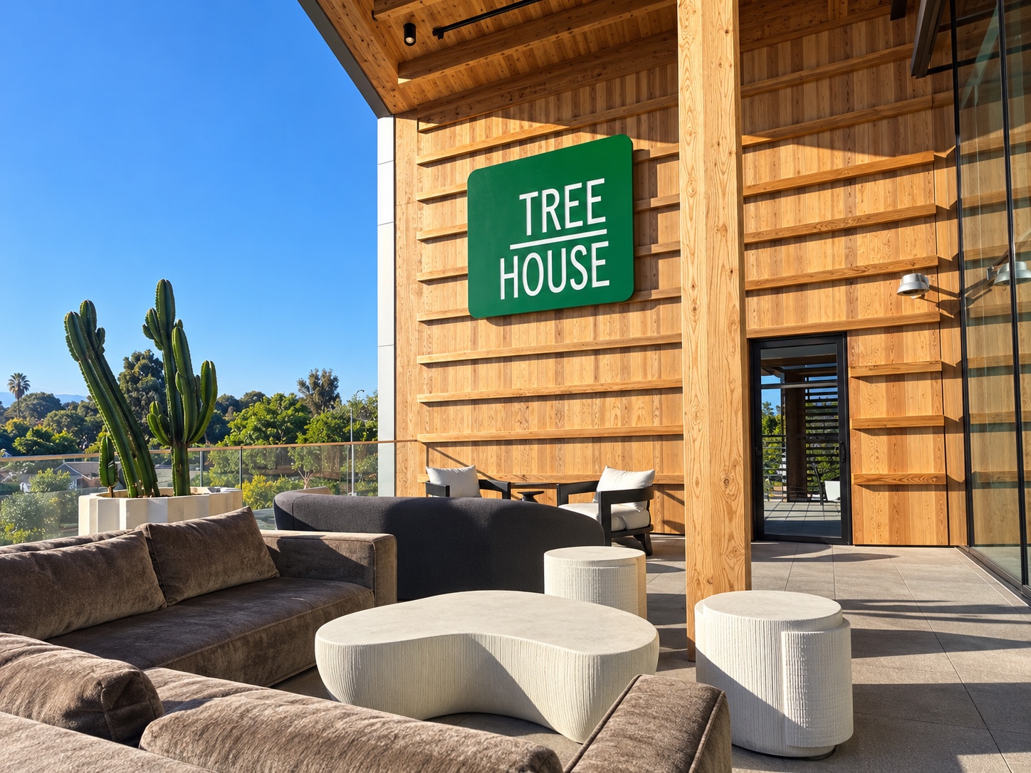 The outdoor couches, cactus planters and Treehouse sign overlooking Sorrento Mesa